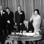 Lyndon Johnson signing the Medicare bill in 1965.