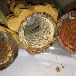 Photo of the inside of drinking water pipes with lead scale.