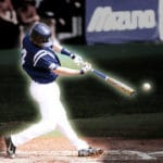 Photo of baseball hitter swinging at oncoming ball.