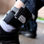 A registered sex offender shows his GPS ankle bracelet. Many such offenders on electronic monitoring become homeless because of restrictive housing laws that prohibit them from living near schools, parks and day-care centers. Photo thanks to wisconsinwatech.org