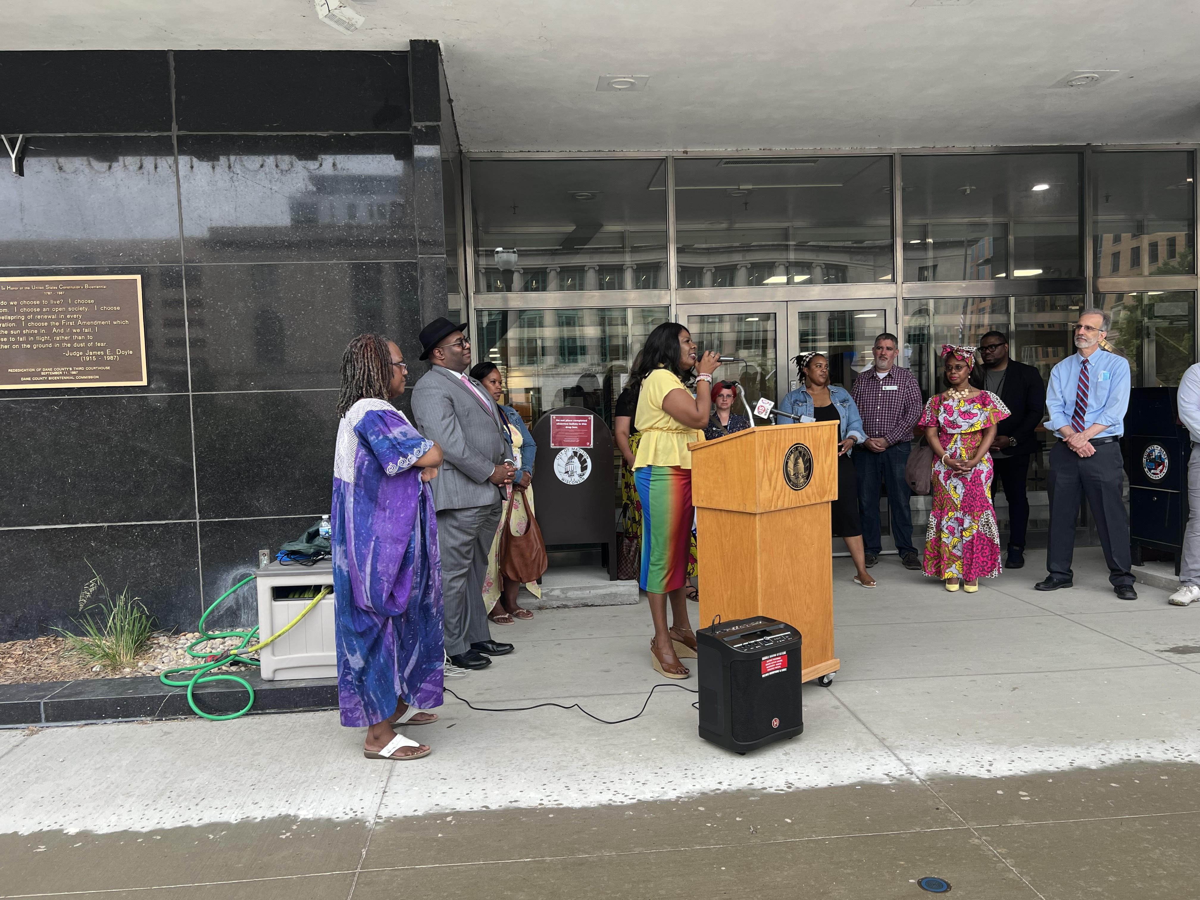 Madison leaders and community members raise the Juneteenth flag